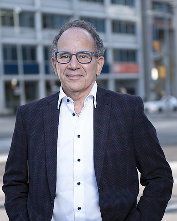 Murray J. Hart smiling in a suit