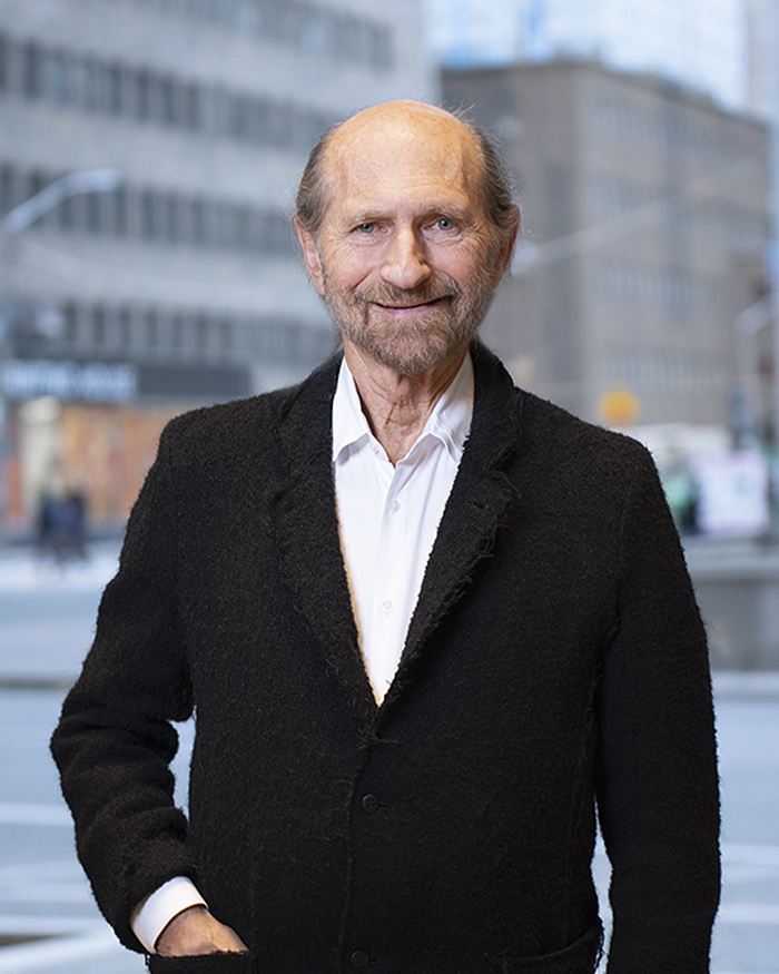 Walter M. Traub, smiling in a suit