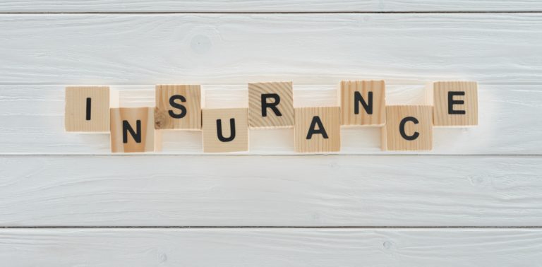 wooden letters spelling out insurance