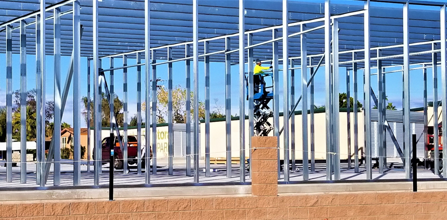 person on a skyjack working at a construction site